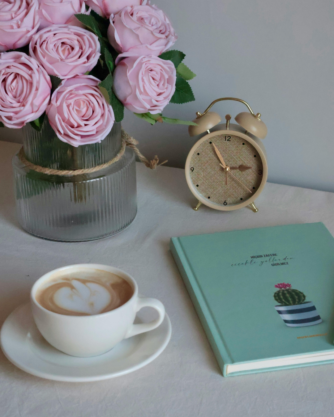 Coffee, roses, and journal